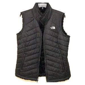 Size LG women’s black reversible North Face vest